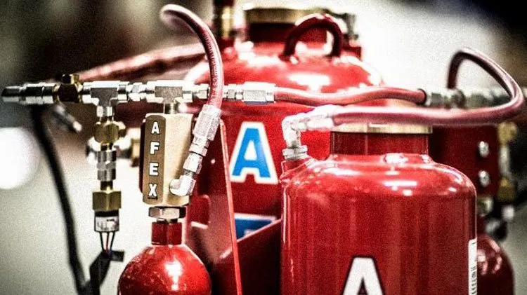 AFEX fire suppression cylinders and manifold mounted for equipment protection