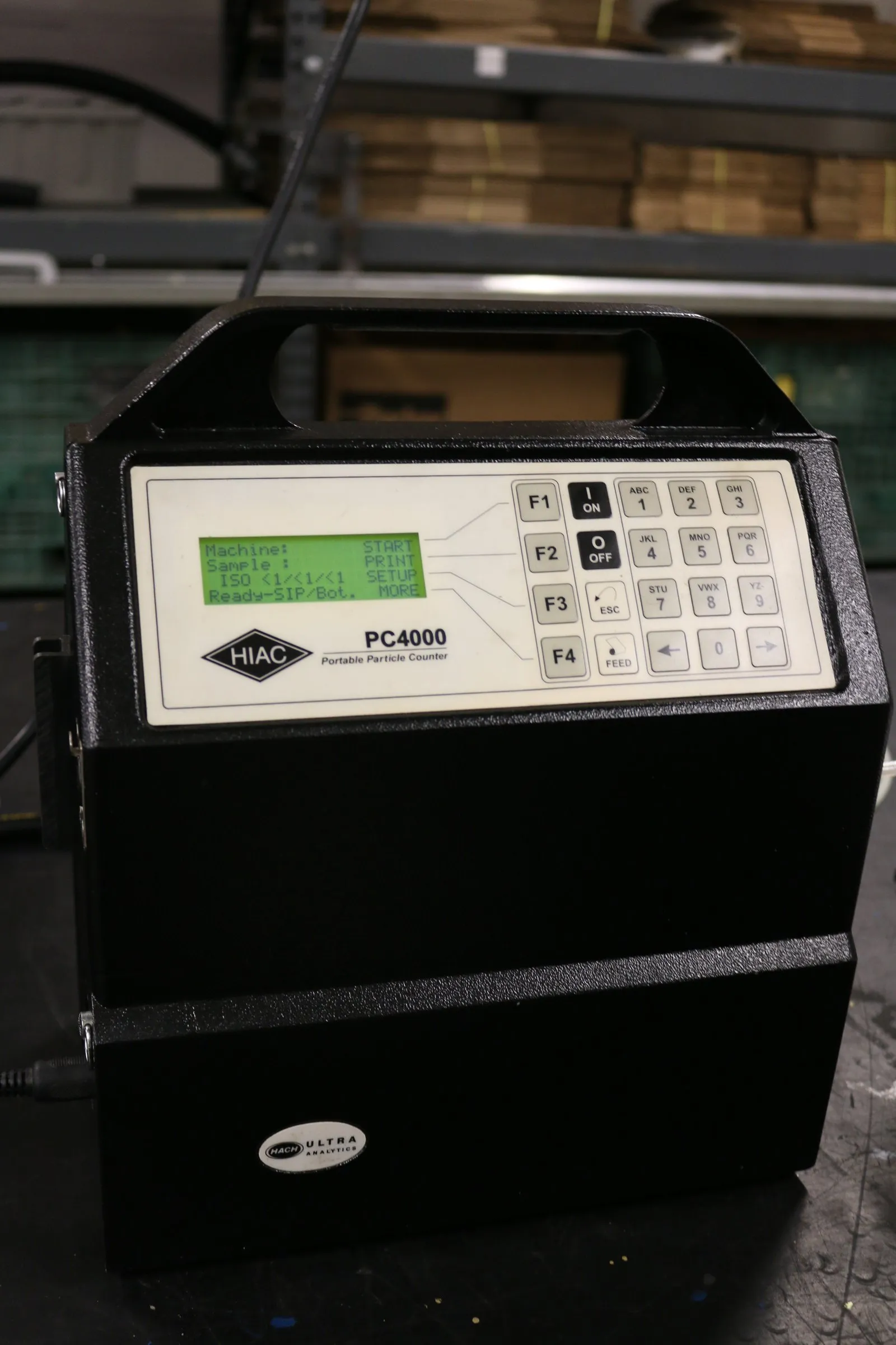 HIAC PC4000 portable particle counter on a workbench