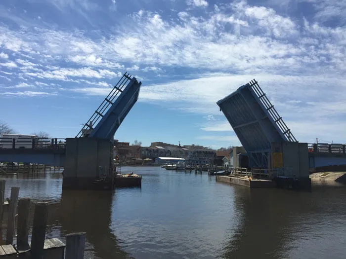 A bascule bridge with both leaves raised over a river