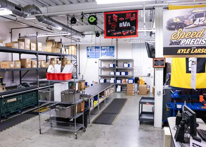 Stocked shelving and the hose assembly workbench inside MFP's ParkerStore in Hudsonville, Michigan.