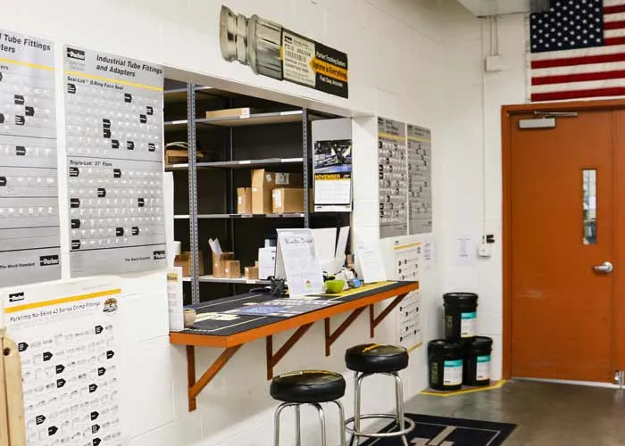 Parker industrial tube fitting reference charts above the ParkerStore work counter in Hudsonville, Michigan.
