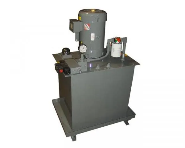 A small gray hydraulic power unit with a single motor and gauge, shown against a plain background